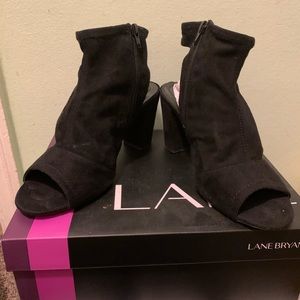 Gently used zipper, open toe, exposed heel bootie